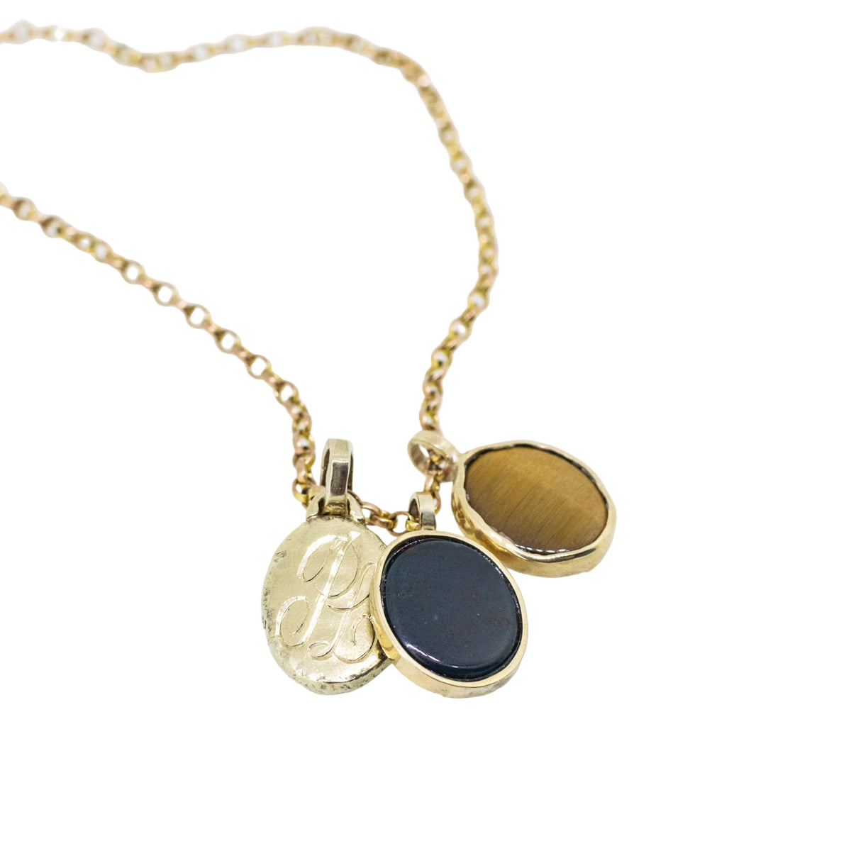 Gold necklace with a black pendant