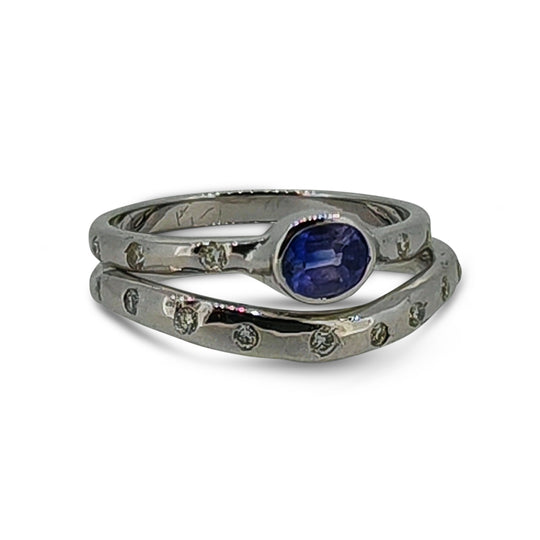 Silver ring with small diamonds on a white background