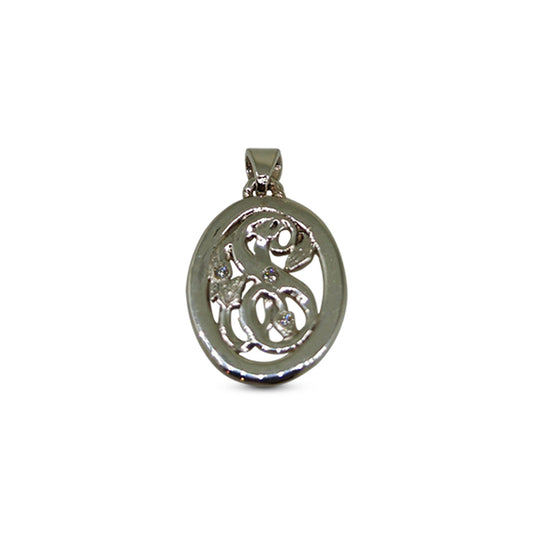 Silver pendant with intricate design on a white background