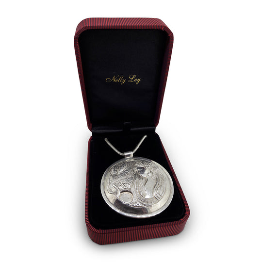 Solid Silver Disk Pendant with Muse & Floral Motif – Repoussé Design