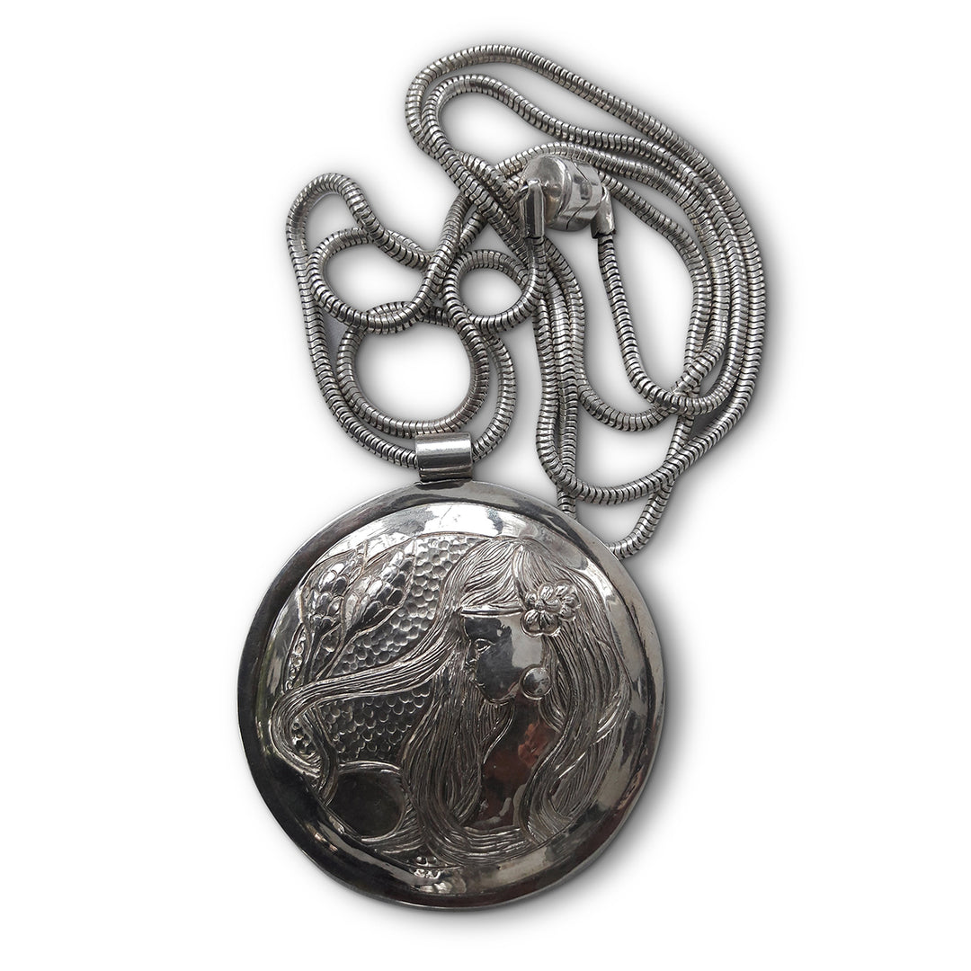 Solid Silver Disk Pendant with Muse & Floral Motif – Repoussé Design
