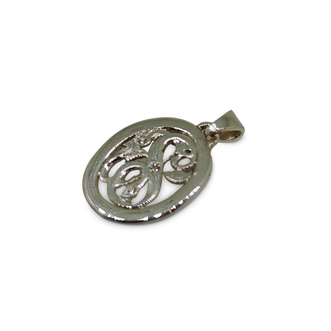 Silver pendant with intricate design on a white background
